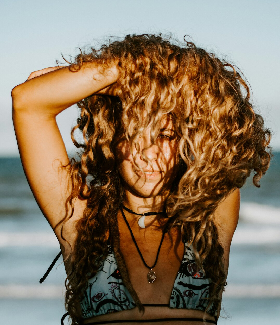 Portrait of a woman with curly hair smiling
