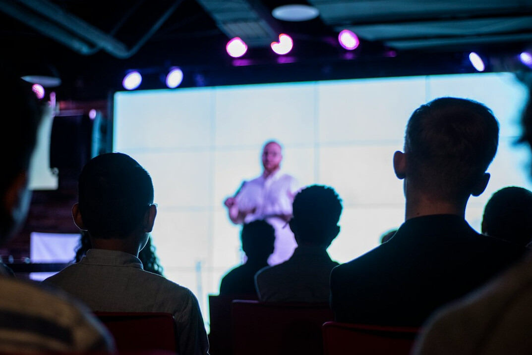 confident public speaker on stage