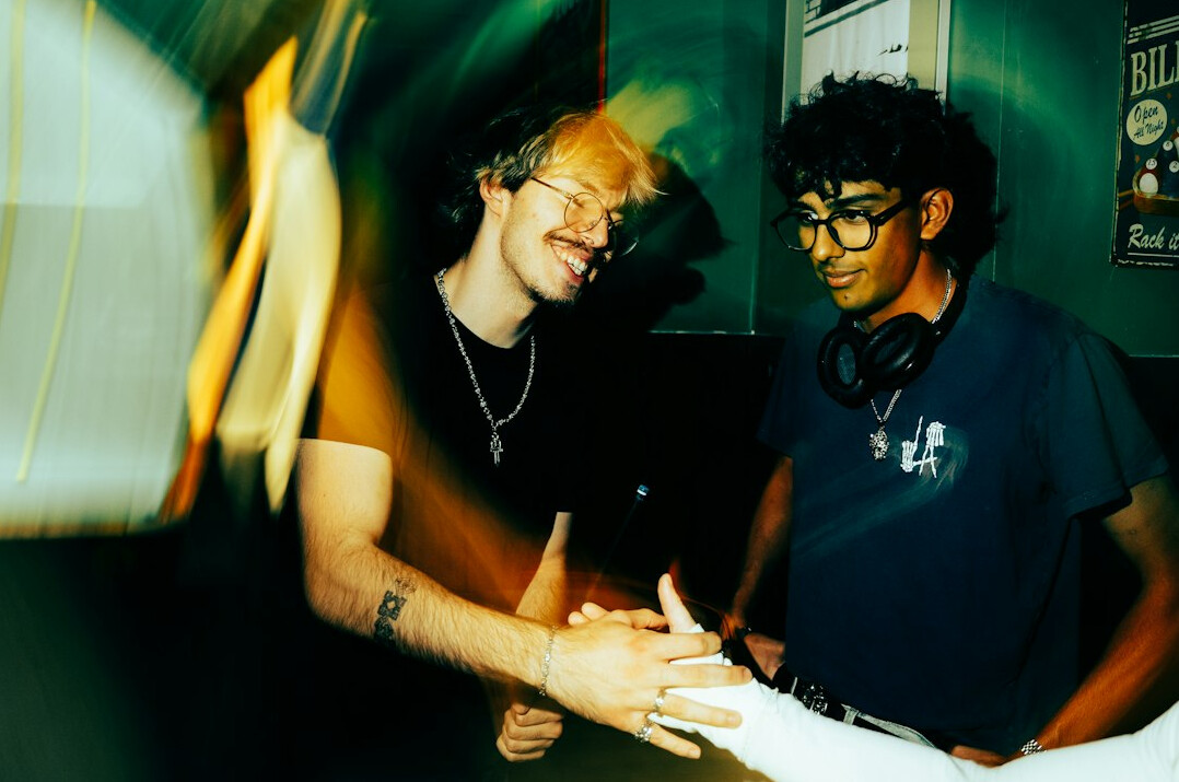 smiling people shaking hands