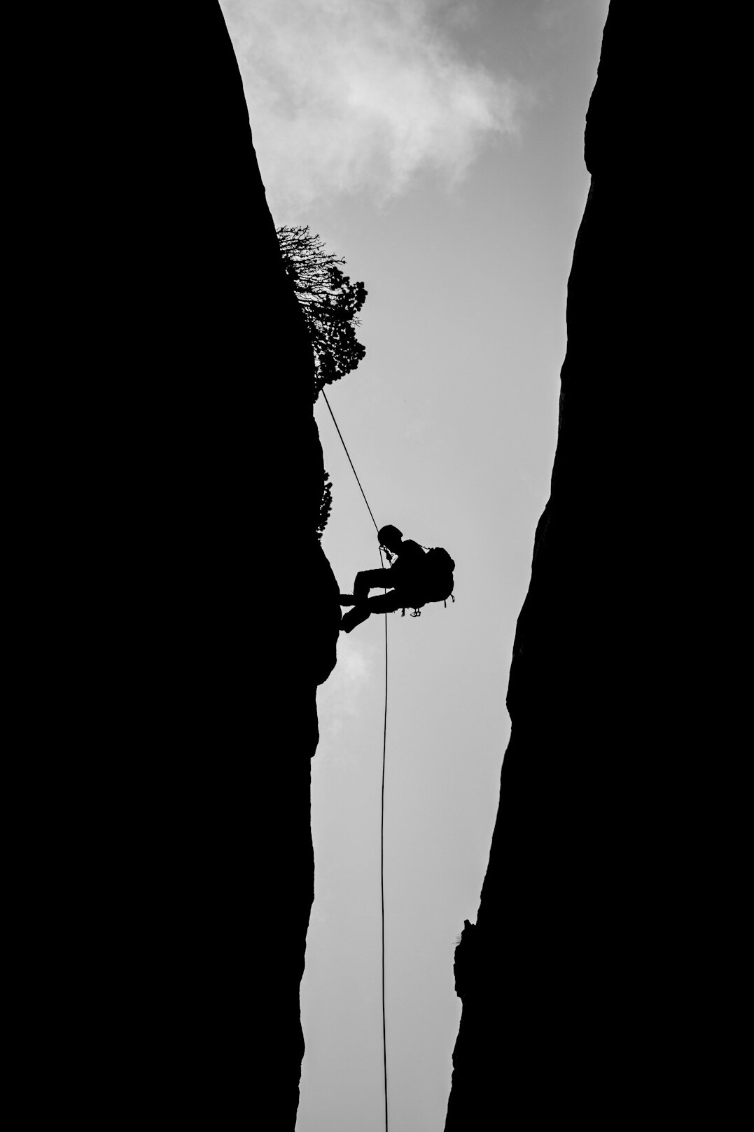 person climbing mountain
