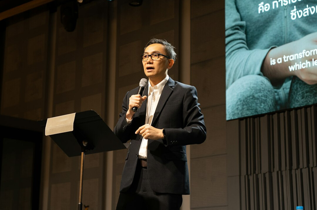 confident public speaker on stage